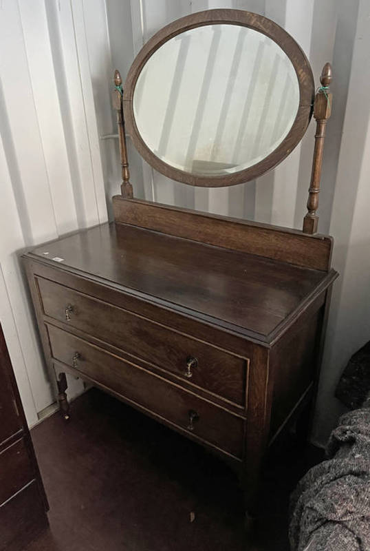 OAK DRESSING CHEST WITH OVAL MIRROR OVER 2 DRAWERS ON TURNED SUPPORTS,