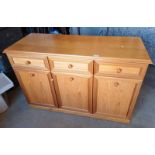 TEAK SIDEBOARD WITH 3 DRAWERS OVER 3 PANEL DOORS - 77CM TALL X 120 CM LONG