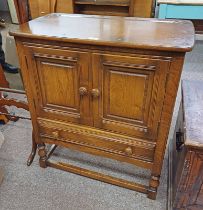 ERCOL ELM CABINET WITH 2 PANEL DOORS OVER SINGLE DRAWER,