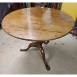 19TH CENTURY MAHOGANY FLIP TOP CIRCULAR PEDESTAL TABLE ON 3 SPREADING SUPPORTS.