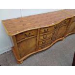 LATE 20TH CENTURY INLAID YEW SIDEBOARD WITH SHAPED FRONT & FOUR CENTRALLY SET DRAWERS FLANKED ON