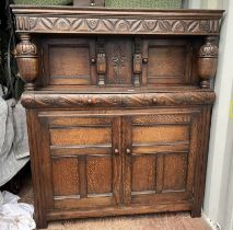 19TH CENTURY STYLE CARVED OAK COURT CUPBOARD WITH 2 SMALL PANEL DOORS OVER 2 DRAWERS & 2 PANEL