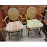 2 20TH CENTURY MAHOGANY OPEN ARMCHAIRS WITH BERGERE PANEL BACKS ON QUEEN ANNE SUPPORTS