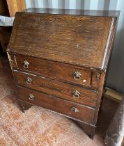 OAK BUREAU WITH FALL FRONT OVER 3 DRAWERS ON BRACKET SUPPORTS