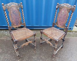 PAIR OF CARVED OAK HAND CHAIRS WITH BARLEY TWIST DECORATION & BERGERE PANEL BACKS & SEATS