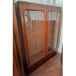 19TH CENTURY MAHOGANY BOOKCASE WITH 2 GLAZED PANEL DOORS OPENING TO SHELVED INTERIOR ON PLINTH BASE,