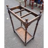 EARLY 20TH CENTURY OAK STICK STAND ON BOBBIN SUPPORTS