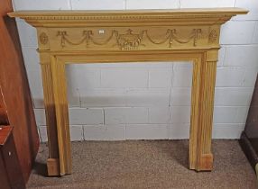 PINE FIRE SURROUND WITH DENTIL CORNICE & CARVED DECORATION.