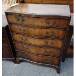 WALNUT SERPENTINE CHEST OF 5 DRAWERS ON BRACKET SUPPORTS.