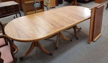 LATE 20TH CENTURY INLAID YEW TRIPLE PEDESTAL DINING TABLE WITH 2 EXTRA LEAVES.