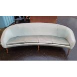 OVERSTUFFED 4 SEATER SETTEE ON TURNED TEAK SUPPORTS