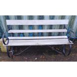 WOODEN GARDEN BENCH WITH PAINTED SHAPED CAST METAL ENDS