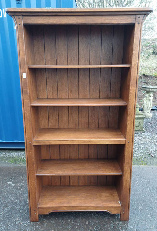 OAK OPEN BOOKCASE LABELLED SHERRY TO SIDE.