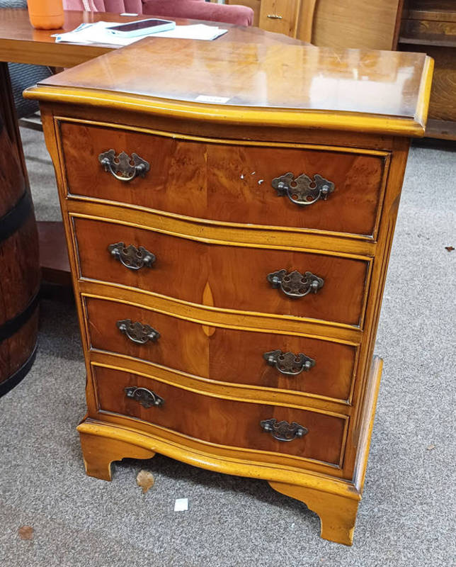 YEW WOOD CHEST OF DRAWERS WITH SHAPED FRONT & 4 DRAWERS ON BRACKET SUPPORTS,