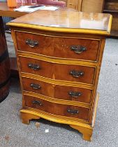 YEW WOOD CHEST OF DRAWERS WITH SHAPED FRONT & 4 DRAWERS ON BRACKET SUPPORTS,