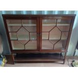 EARLY 20TH CENTURY MAHOGANY BOOKCASE WITH 2 ASTRAGAL GLASS PANEL DOORS - 139 CM TALL X 151 CM LONG