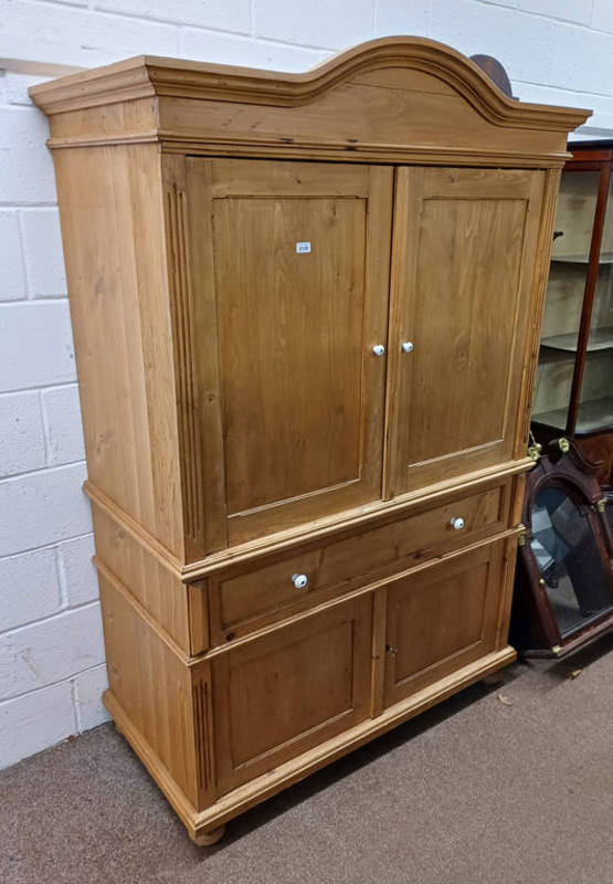 PINE CABINET WITH 2 SLIDING PANEL DOORS OVER SINGLE DRAWER OVER 2 PANEL DOORS.