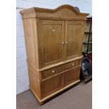 PINE CABINET WITH 2 SLIDING PANEL DOORS OVER SINGLE DRAWER OVER 2 PANEL DOORS.