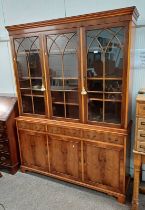 REPODUX YEW BOOKCASE WITH 3 ASTRAGAL GLASS PANEL DOORS OVER 3 DRAWERS OVER 3 PANEL DOORS ON BRACKET