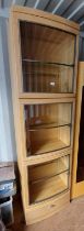 OAK DISPLAY CABINET WITH 3 BOW FRONT GLAZED PANEL DOORS OPENING TO GLASS SHELVED INTERIOR OVER