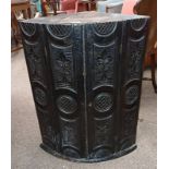 LATE 19TH CENTURY EBONISED CORNER CABINET WITH 2 PANEL DOORS WITH CARVED DECORATION OPENING TO