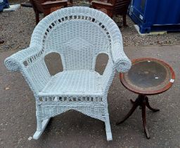 PAINTED WICKER ROCKING CHAIR & MAHOGANY OVAL FLIP TOP PEDESTAL TABLE WITH LEATHER INSET TOP.
