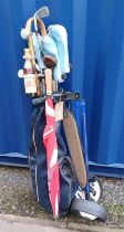 GOLF BAG WITH CADDY & CONTENTS OF VARIOUS GOLF CLUBS AND WALKING STICK WITH BOTTLE 'SCHARLACHBERG