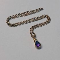 9CT GOLD AMETHYST SET PENDANT ON A 9CT GOLD CHAIN - 5.