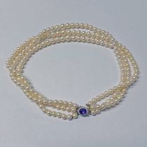 TRIPLE STRAND GRADUATED CULTURED PEARL NECKLACE ON A 9CT GOLD AMETHYST & DIAMOND CLUSTER CLASP IN A