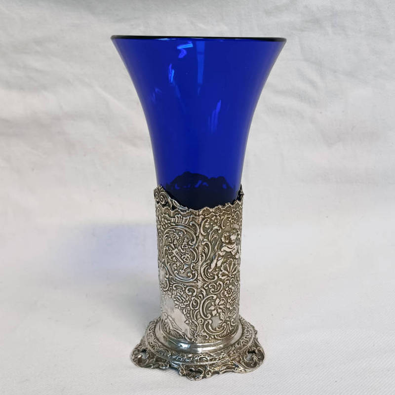 VICTORIAN SILVER & BLUE GLASS TAPERING VASE DECORATED WITH CHERUBS & MUSICAL INSTRUMENTS WITH