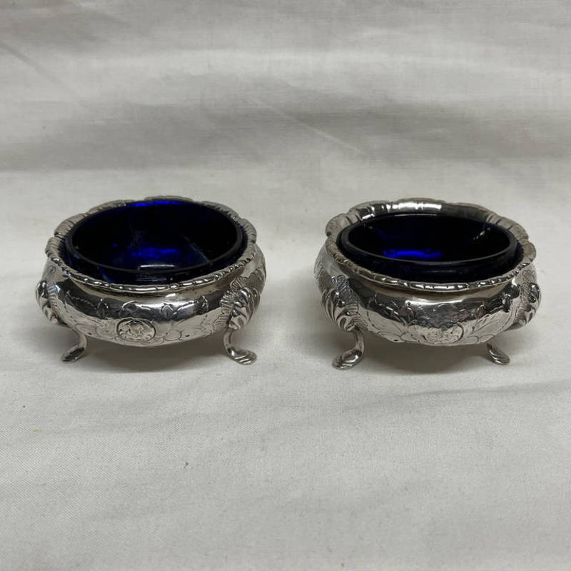 PAIR OF VICTORIAN SILVER CIRCULAR SALTS WITH FOLIATE EMBOSSED DECORATION BY MAPPIN BROS,
