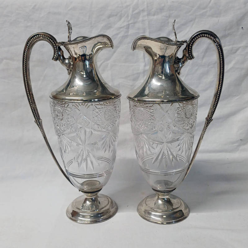 PAIR OF VICTORIAN SILVER MOUNTED CUT GLASS CLARET JUGS WITH BEADED SHAPED HANDLES & PIERCED THUMB