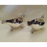 PAIR SILVER SAUCE BOATS ON 3 SUPPORTS,