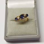 18CT GOLD 5-STONE DIAMOND SET TWIST RING - RING SIZE: J Condition Report: Sapphires