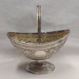 VICTORIAN SILVER SWING HANDLED BON BON BASKET WITH GILT INTERIOR & FOLIATE EMBOSSED DECORATION BY