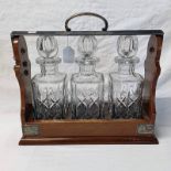 OAK 3-DECANTER TANTALUS WITH SILVER PLATED MOUNTS Condition Report: Marked PB & S to