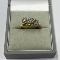 18CT GOLD 3-STONE DIAMOND TWIST RING APPROX. 0.