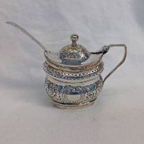 GEORGE III SILVER OVAL MUSTARD POT WITH FOLIATE EMBOSSED DECORATION ON BLUE GLASS LINER BY ROBERT &