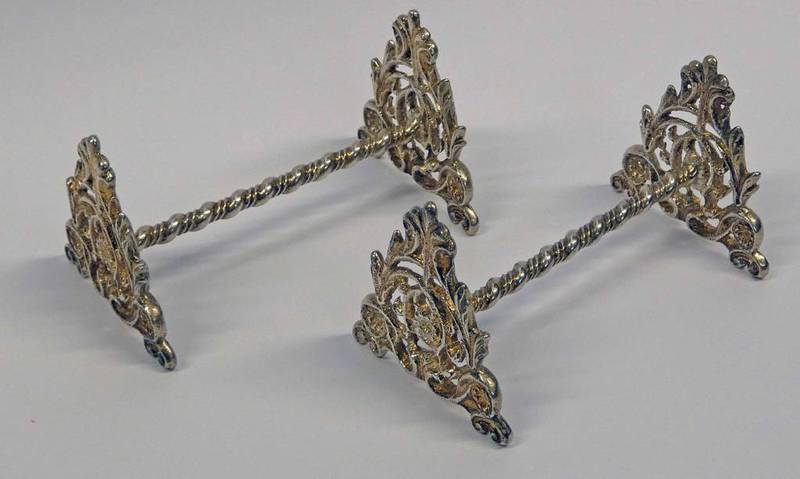 PAIR OF DECORATIVE SILVER KNIFE RESTS WITH FOLIATE ENDS BY HENRY WILLIAMSON,