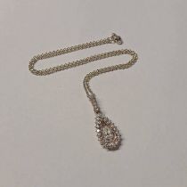 DIAMOND SET PENDANT ON A GOLD CHAIN, THE PEAR SHAPED PENDANT APPROX 1.