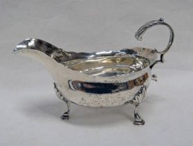 GEORGE III SILVER SAUCE BOAT WITH SCROLL HANDLE ON PAD FEET,