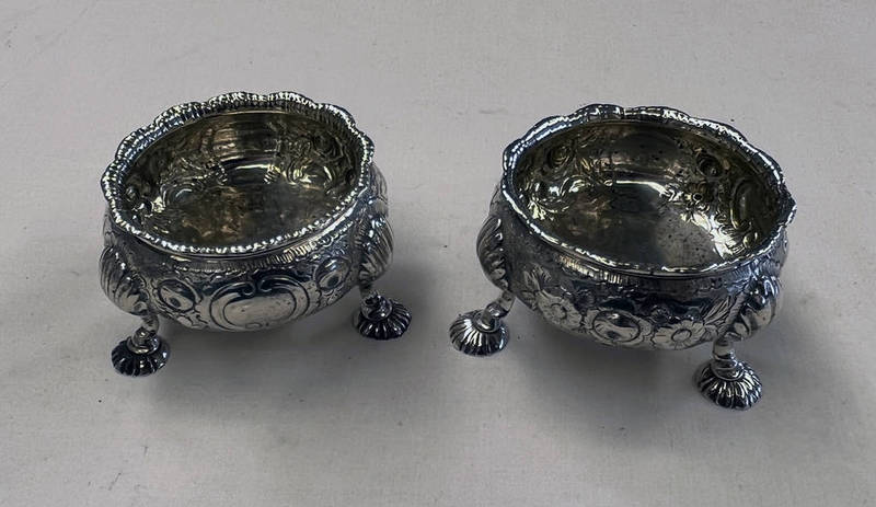 PAIR OF GEORGE II SILVER SALT CELLARS WITH FRUIT DECORATION & 3 PAD FEET,