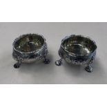 PAIR OF GEORGE II SILVER SALT CELLARS WITH FRUIT DECORATION & 3 PAD FEET,