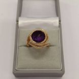 DIAMOND AND AMETHYST GOLD RING,