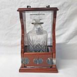 SILVER MOUNTED MAHOGANY TANTALUS WITH SILVER MOUNTED SQUARE GLASS DECANTER