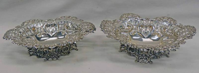 PAIR SILVER PIERCE WORK DISHES ON DECORATIVE BASES BY WILLIAM COMYNS,