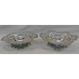 PAIR SILVER PIERCE WORK DISHES ON DECORATIVE BASES BY WILLIAM COMYNS,