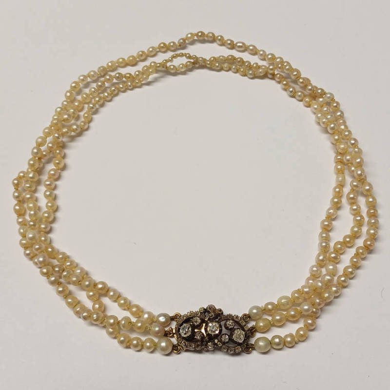 19TH CENTURY NATURAL SALTWATER GRADUATED TRIPLE STRAND PEARL NECKLACE ON A GOLD DIAMOND CLUSTER