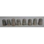 8 VARIOUS SILVER THIMBLES INCLUDING THE SPA NEWQUAY & 1 BY CHARLES HORNER - 40G TOTAL