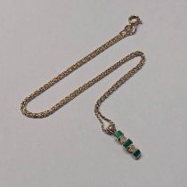 GOLD EMERALD & DIAMOND SET PENDANT ON A 9CT GOLD CHAIN Condition Report: Emeralds